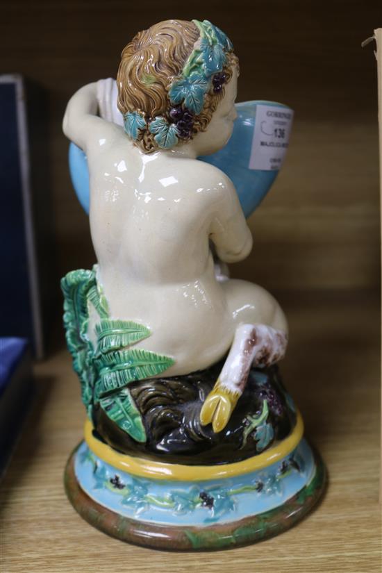 A Victorian majolica model of a faun holding a nautilus shell height 22cm